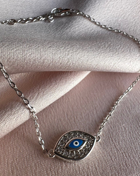 6 Sterling Silver with rhodium 8x12mm evil eye bracelet with cubic zirconia 7"
