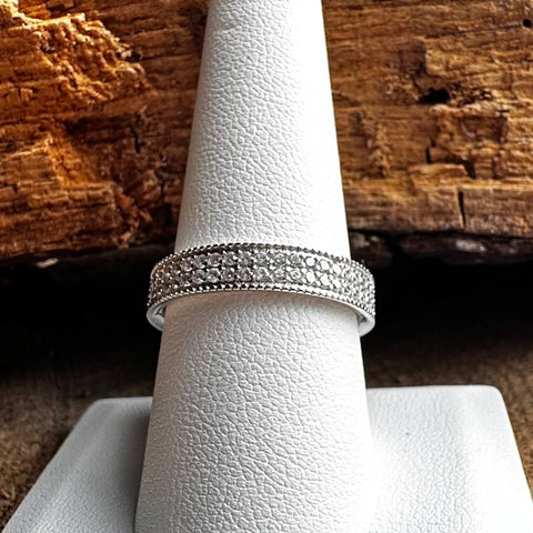 5 Sterling Silver with rhodium, cubic zirconia eternity ring with 5mm width band.