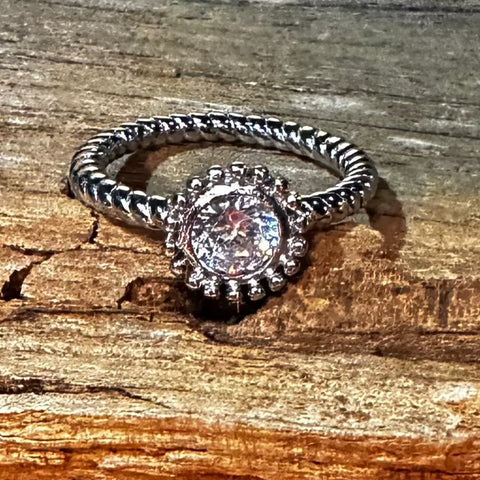 Sterling Silver with rhodium flower ring with 5mm cubic zirconia 2mm twisted band