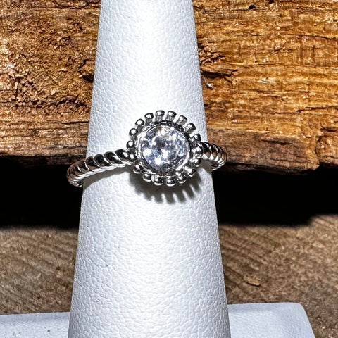  4Sterling Silver with rhodium flower ring with 5mm cubic zirconia 2mm twisted band