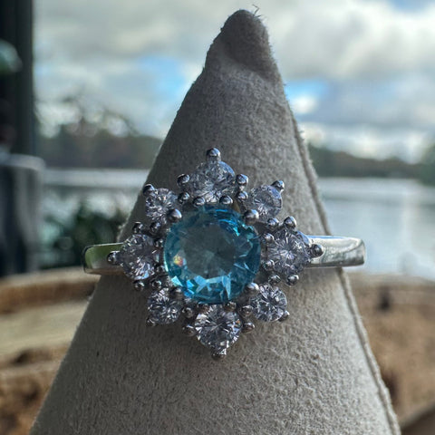 9 Sterling Silver with rhodium 11 mm flower ring 2mm band Blue cubic zirconia