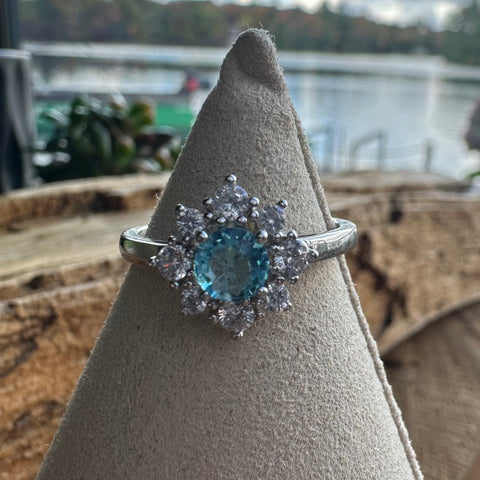 10 Sterling Silver with rhodium 11 mm flower ring 2mm band Blue cubic zirconia