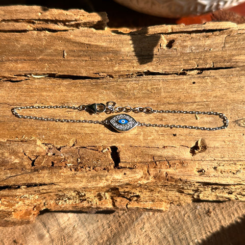 1 Sterling Silver with rhodium 8x12mm evil eye bracelet with cubic zirconia 7"