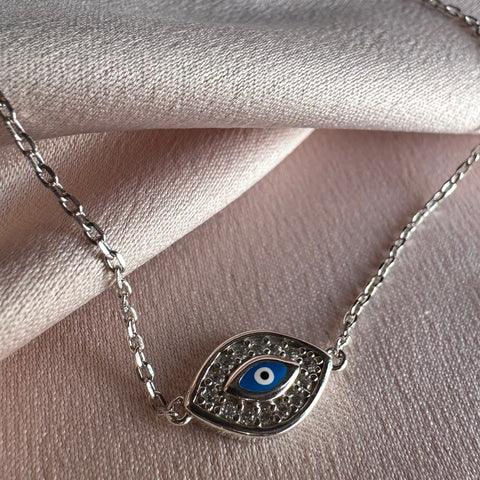 5 Sterling Silver with rhodium 8x12mm evil eye bracelet with cubic zirconia 7"