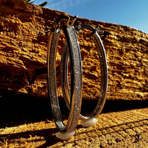 4 Rhodium plated on Sterling Silver, oval shape hoop earrings with stardust finish