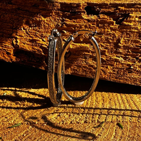 3 Rhodium plated on Sterling Silver, oval shape hoop earrings with stardust finish