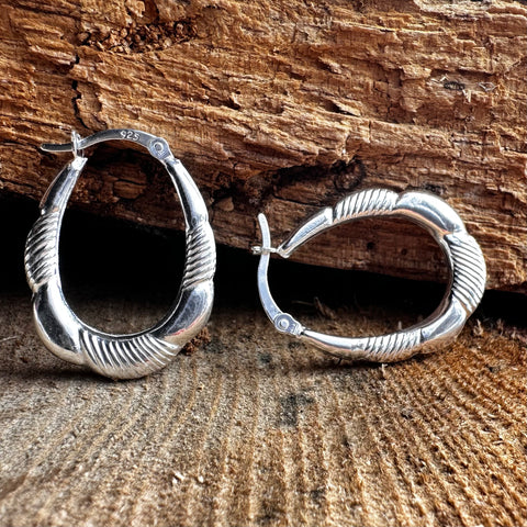 Sterling Silver fancy style oval shape hoop with a Hinge Back