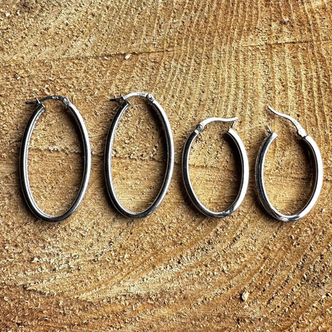 5 Rhodium plated on Sterling Silver, oval shape hoop earrings with stardust finish
