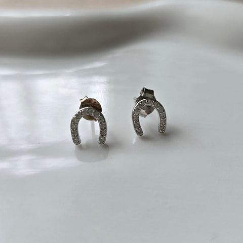 Sterling silver with rhodium, 6.5x7mm horseshoe stud earrings with cubic zirconia 10