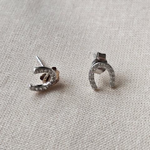 Sterling silver with rhodium, 6.5x7mm horseshoe stud earrings with cubic zirconia 7